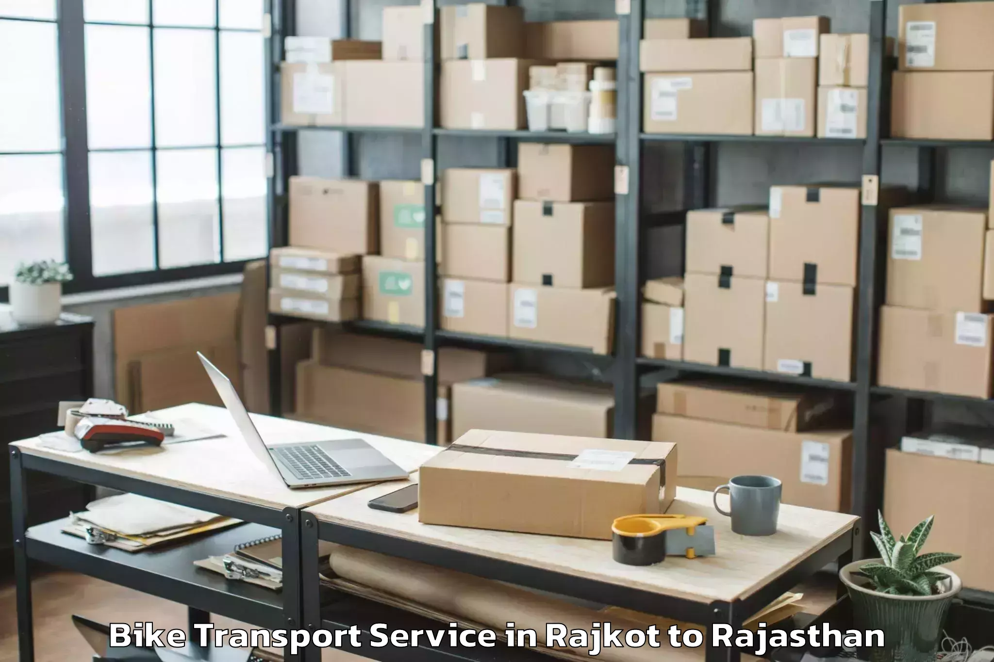 Book Rajkot to Sheoganj Bike Transport Online